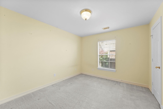 spare room with light colored carpet