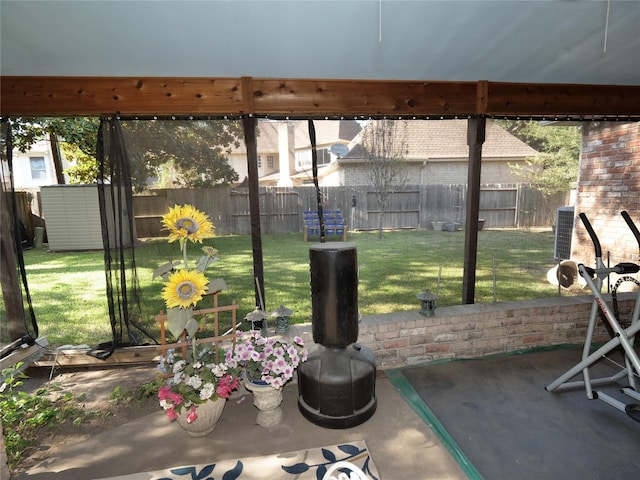 exterior space featuring a storage unit and a patio