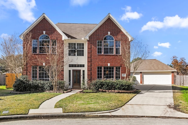 view of front of property with a garage and a front yard