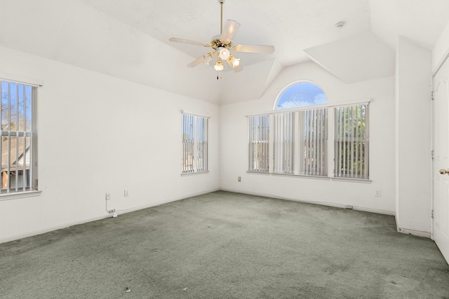 unfurnished room featuring lofted ceiling, ceiling fan, and carpet flooring