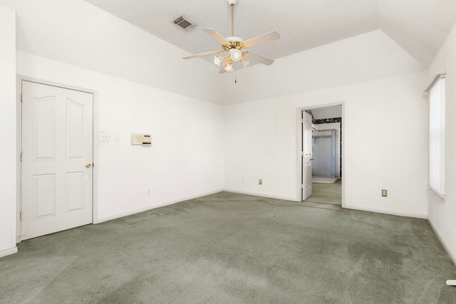 carpeted spare room with lofted ceiling and ceiling fan