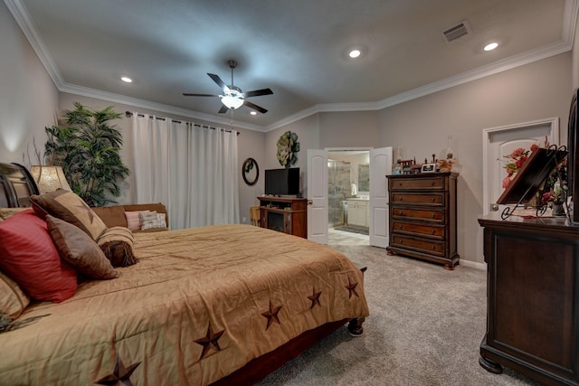 carpeted bedroom with ceiling fan, ensuite bath, and ornamental molding