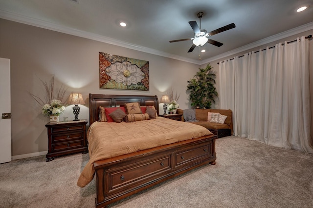 carpeted bedroom featuring crown molding and ceiling fan