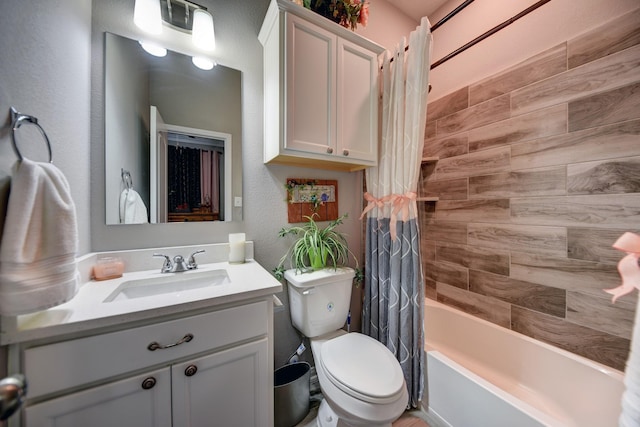 full bathroom with vanity, toilet, and shower / tub combo with curtain