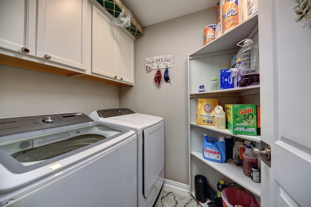 laundry area with cabinets and independent washer and dryer