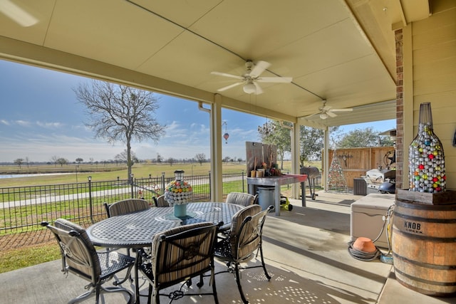 view of patio featuring a rural view and ceiling fan