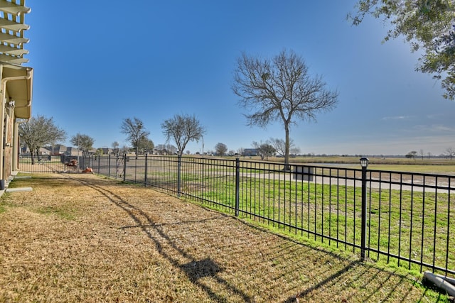 view of yard with a rural view