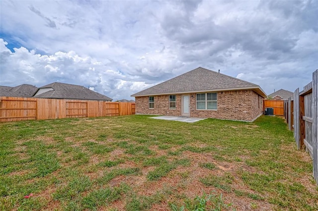 rear view of property with a patio area and a lawn