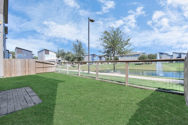 view of yard with a water view