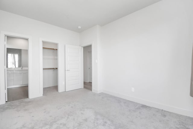 unfurnished bedroom featuring light colored carpet