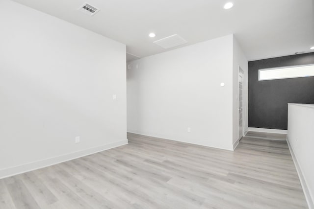 spare room featuring light hardwood / wood-style floors