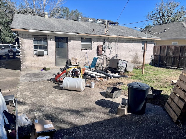 rear view of property featuring a patio area