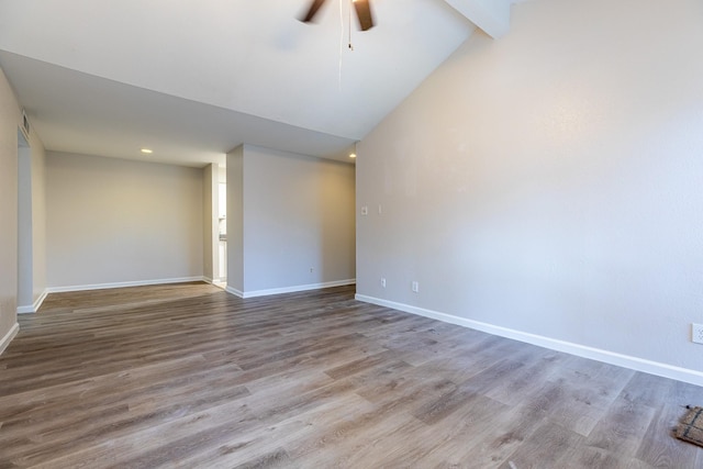 unfurnished room with hardwood / wood-style flooring, ceiling fan, high vaulted ceiling, and beamed ceiling