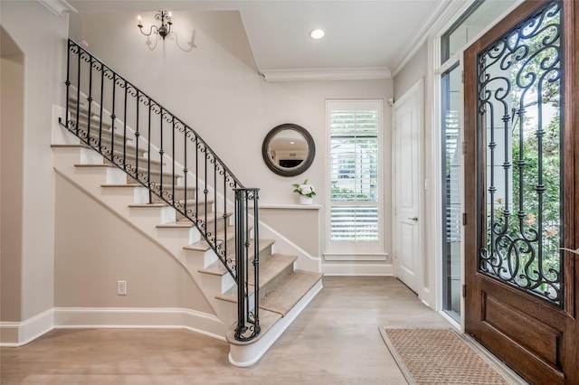 entryway featuring hardwood / wood-style flooring and crown molding