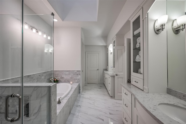 bathroom featuring vanity and separate shower and tub