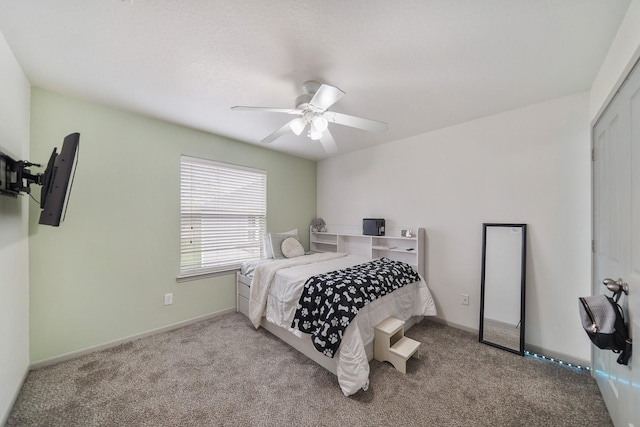 bedroom with ceiling fan and carpet