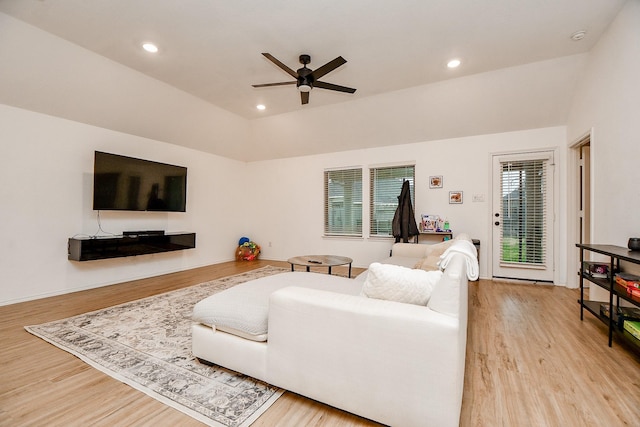 living room featuring ceiling fan, a healthy amount of sunlight, and light wood-type flooring