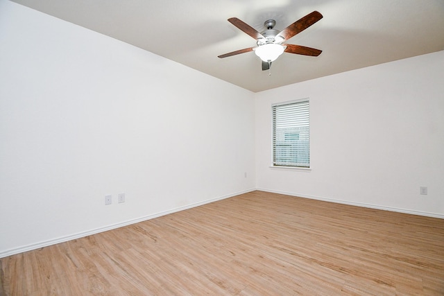 spare room with ceiling fan and light hardwood / wood-style floors