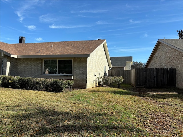 view of property exterior featuring a lawn