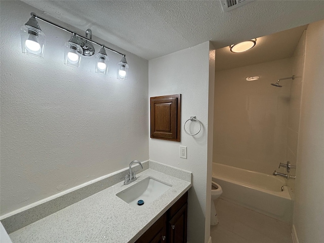 full bathroom with vanity, toilet,  shower combination, and a textured ceiling