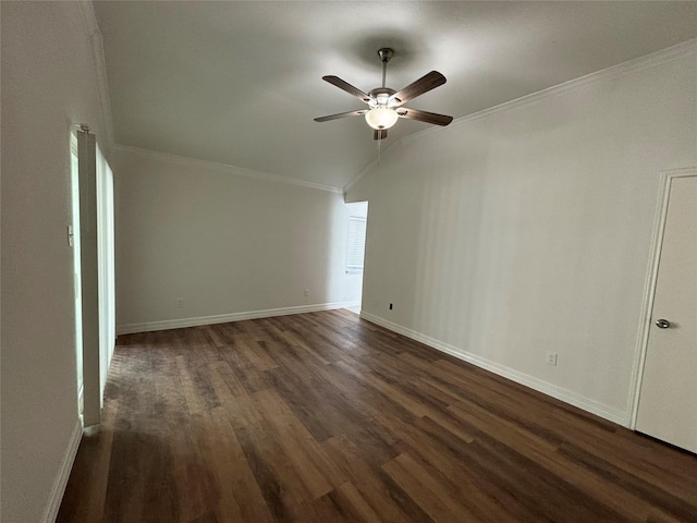 unfurnished room featuring dark wood-type flooring, ceiling fan, ornamental molding, and vaulted ceiling