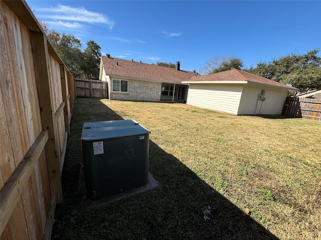 back of property featuring a lawn