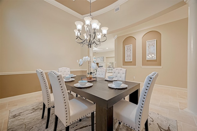 dining area with a notable chandelier, visible vents, ornamental molding, stone finish flooring, and baseboards