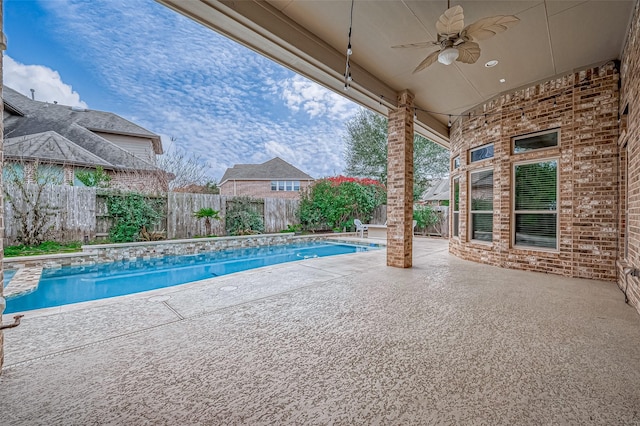 view of pool featuring a patio, a fenced backyard, a ceiling fan, and a fenced in pool