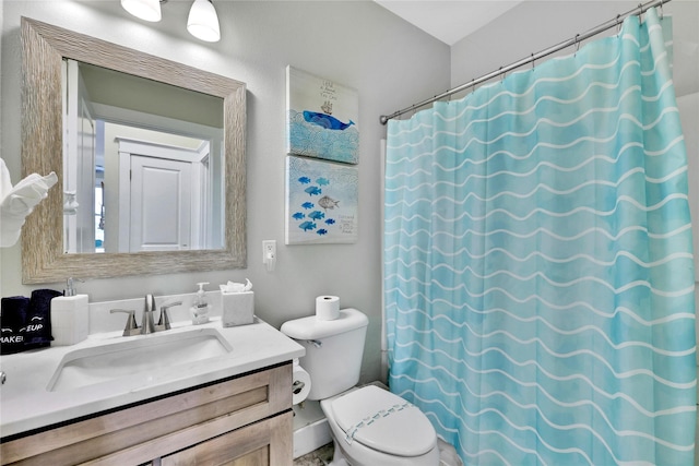 bathroom with vanity, toilet, and a shower with shower curtain