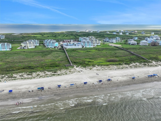 bird's eye view featuring a water view and a view of the beach