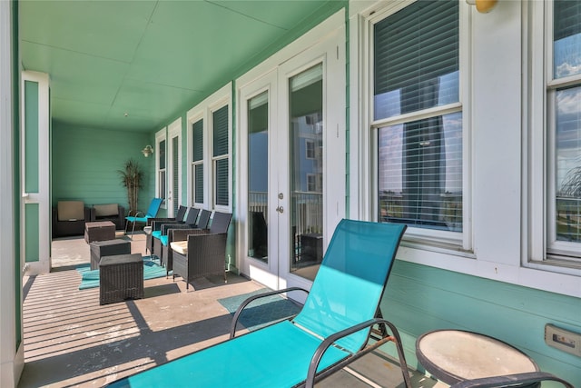 4121 Pointe W Dr Unit 102, Galveston, TX 77554 - view of patio featuring french doors and outdoor lounge area