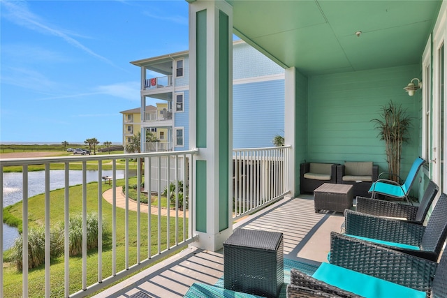 4121 Pointe W Dr Unit 102, Galveston, TX 77554 - balcony featuring a water view and outdoor lounge area