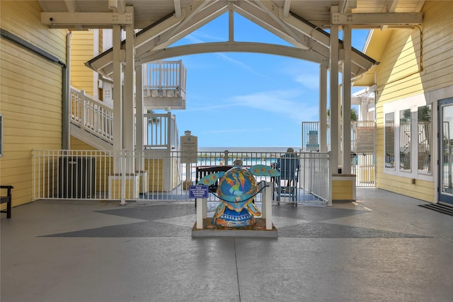 4121 Pointe W Dr Unit 102, Galveston, TX 77554 - view of patio / terrace with a water view