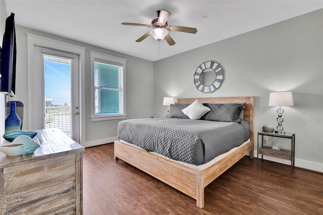 bedroom with dark hardwood / wood-style floors, access to exterior, and ceiling fan