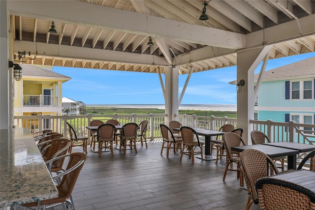 view of patio / terrace with a gazebo and a deck with water view