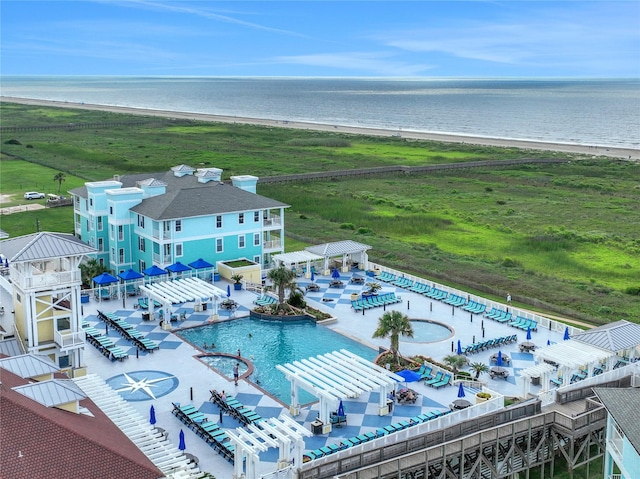 bird's eye view featuring a water view and a view of the beach