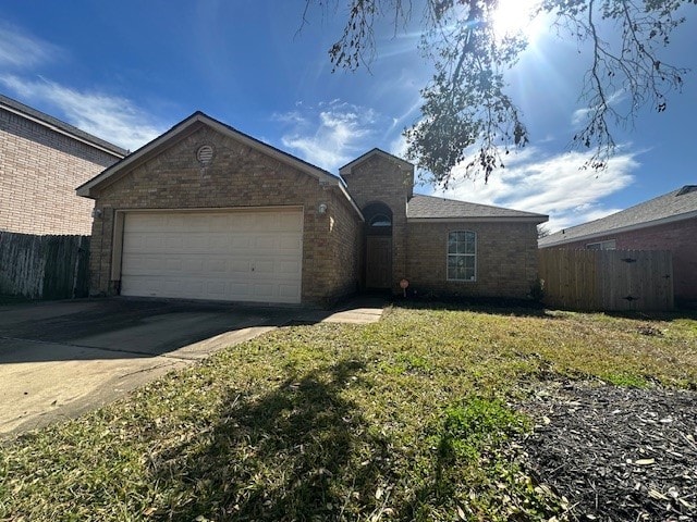 single story home with a garage and a front lawn