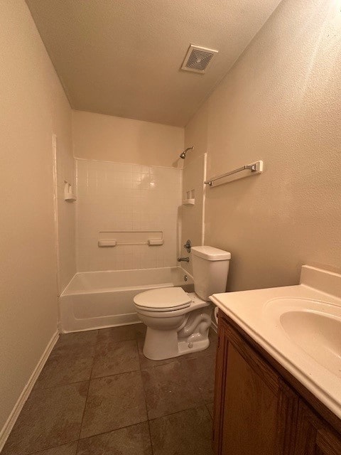 full bathroom featuring shower / tub combination, tile patterned flooring, vanity, a textured ceiling, and toilet