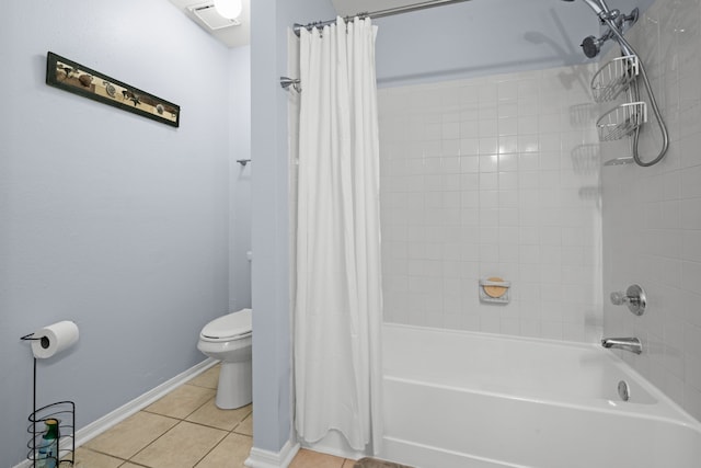 bathroom with shower / bathtub combination with curtain, tile patterned floors, and toilet