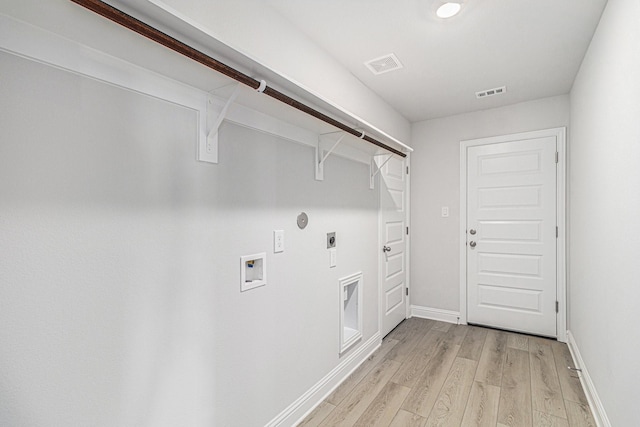 laundry room featuring hookup for a washing machine, hookup for a gas dryer, light wood-type flooring, and electric dryer hookup