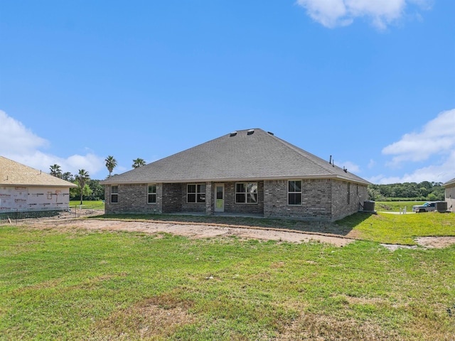 back of house with a yard