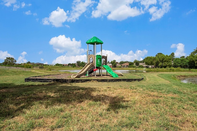 view of playground featuring a lawn