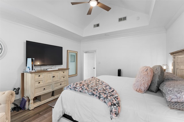 bedroom with dark hardwood / wood-style flooring, ornamental molding, high vaulted ceiling, and ceiling fan