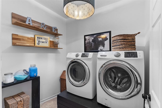 washroom featuring washer and dryer