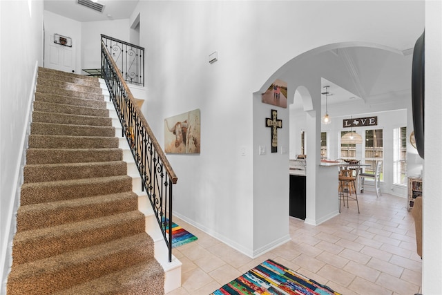 stairs with tile patterned floors