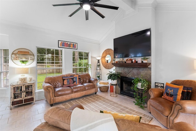 living room featuring light tile patterned floors, vaulted ceiling, ornamental molding, and ceiling fan