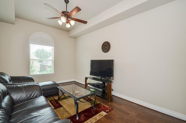 living room with ceiling fan and dark hardwood / wood-style floors