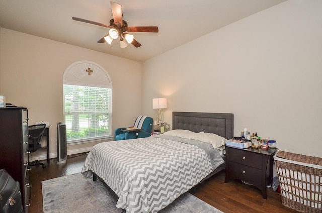 bedroom featuring ceiling fan and dark hardwood / wood-style flooring