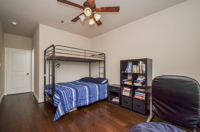 bedroom with dark wood-type flooring and ceiling fan