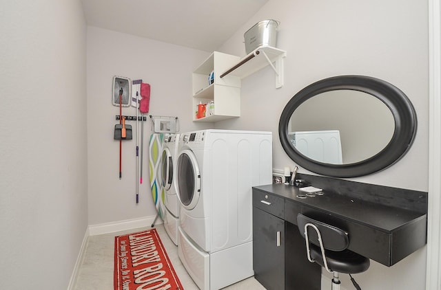 laundry area with washing machine and clothes dryer